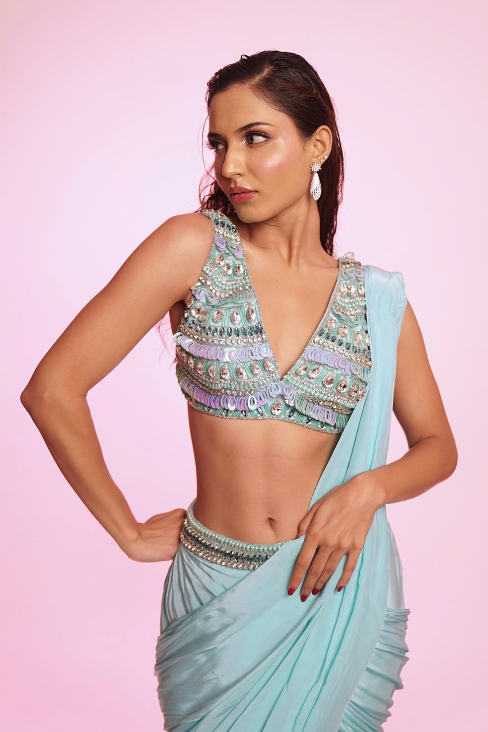 Aqua blue draped saree with embellished V-neck blouse