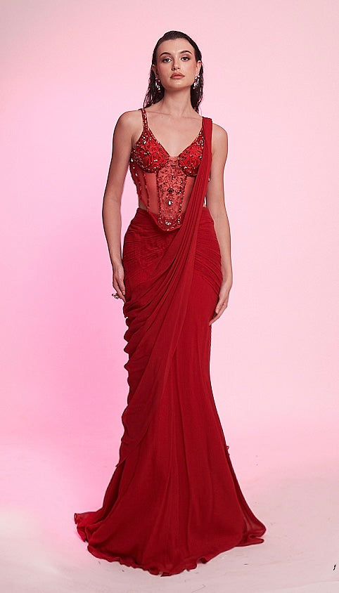 Scarlet red draped saree gown with an intricately embellished corset blouse