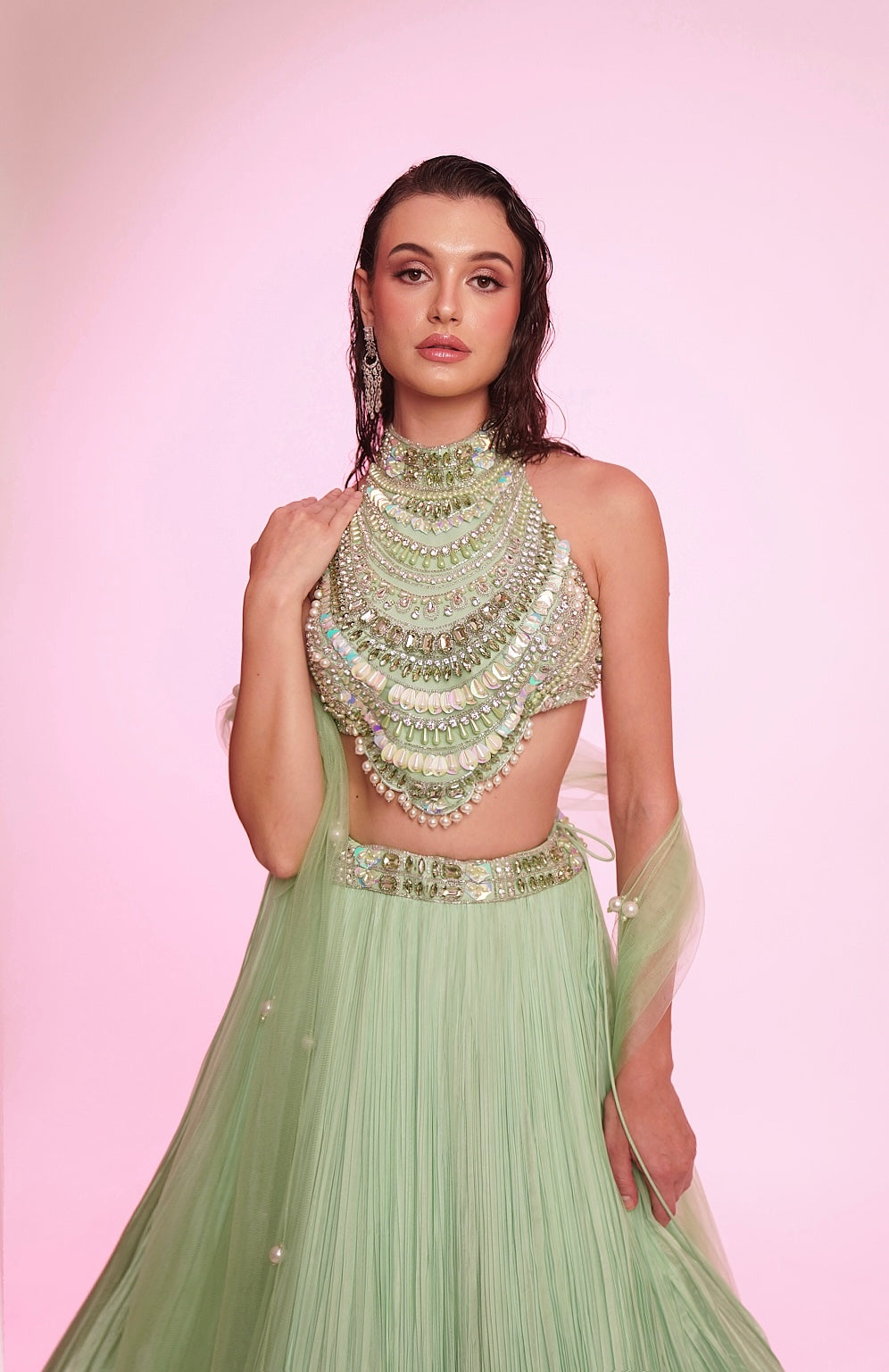 Mint green embellished halter-neck lehenga set with a statement jeweled bodice.