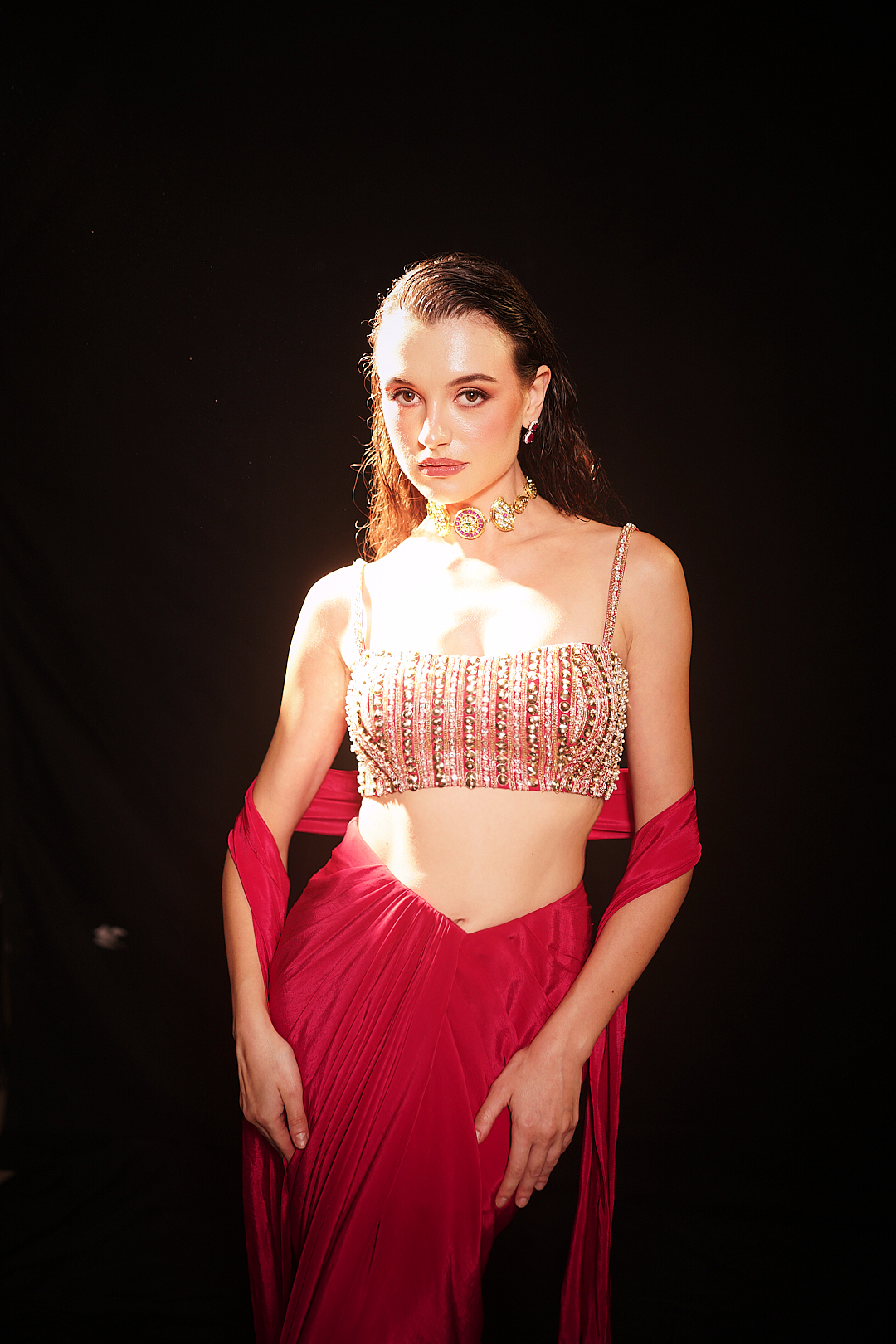 Red draped skirt with embellished strappy blouse