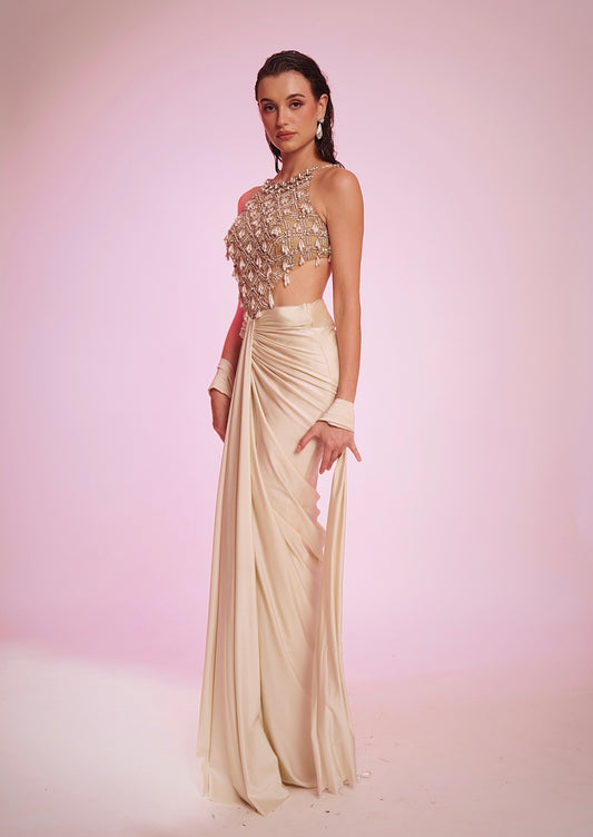 Ivory embellished lycra dress featuring a net halter bodice and draped silhouette
