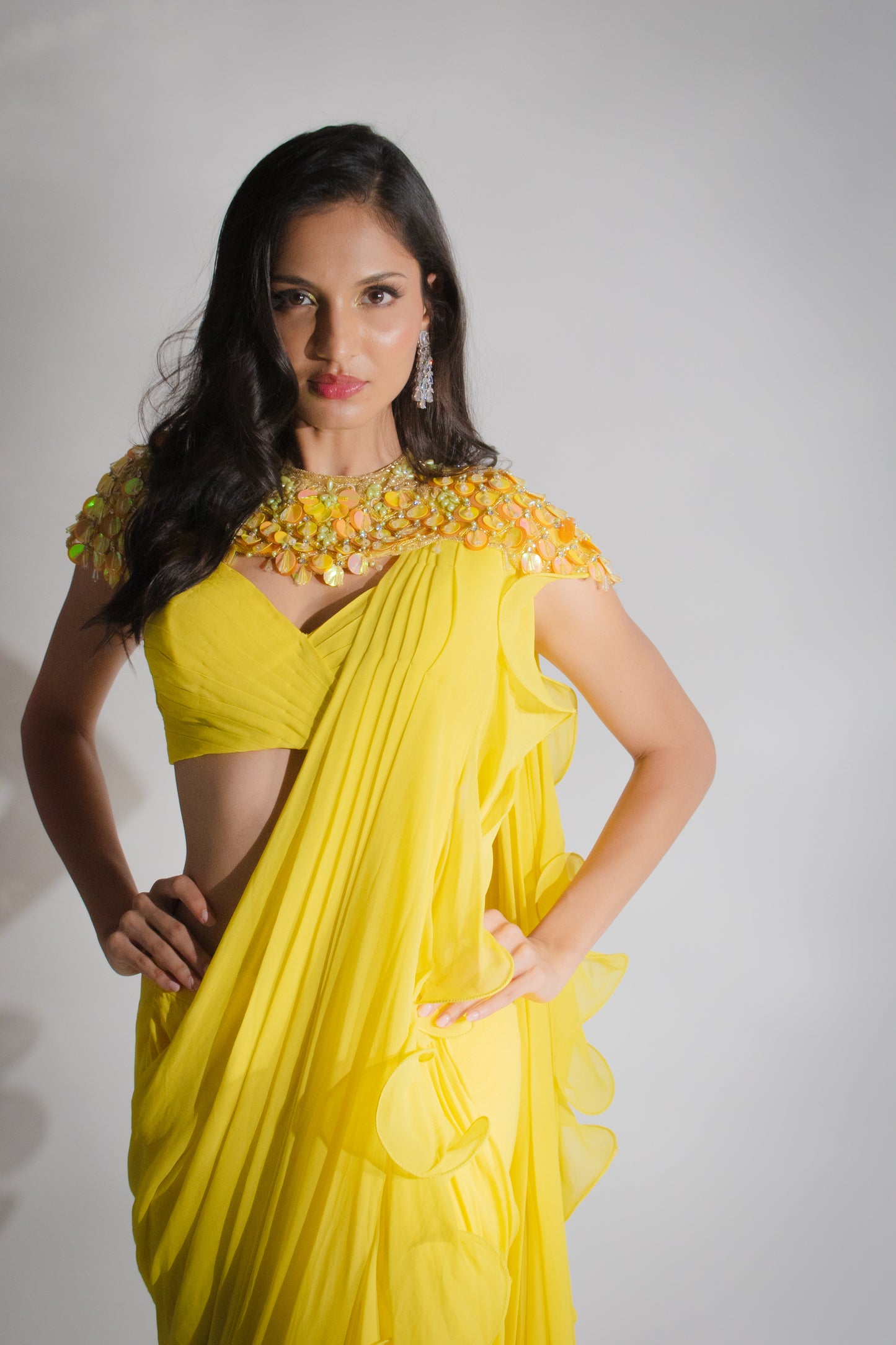 Ruffle Sunshine: Yellow Saree, Strap Blouse, and Embroidered Cape