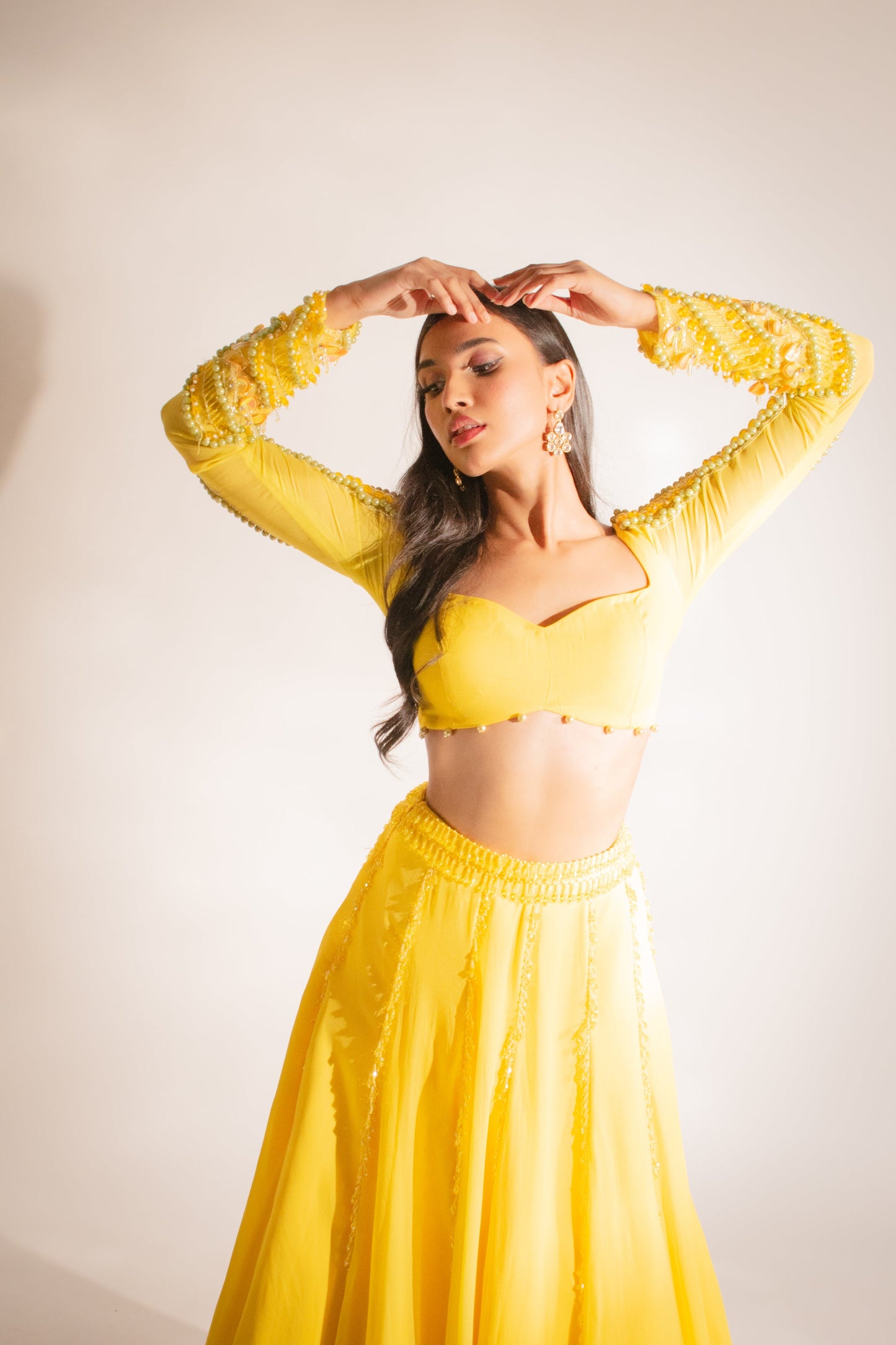 Shivani Singh X Anshika Tak Label (Radiant Opulence: Our Yellow Lengha Set with Exquisite Crystal Embellishments)