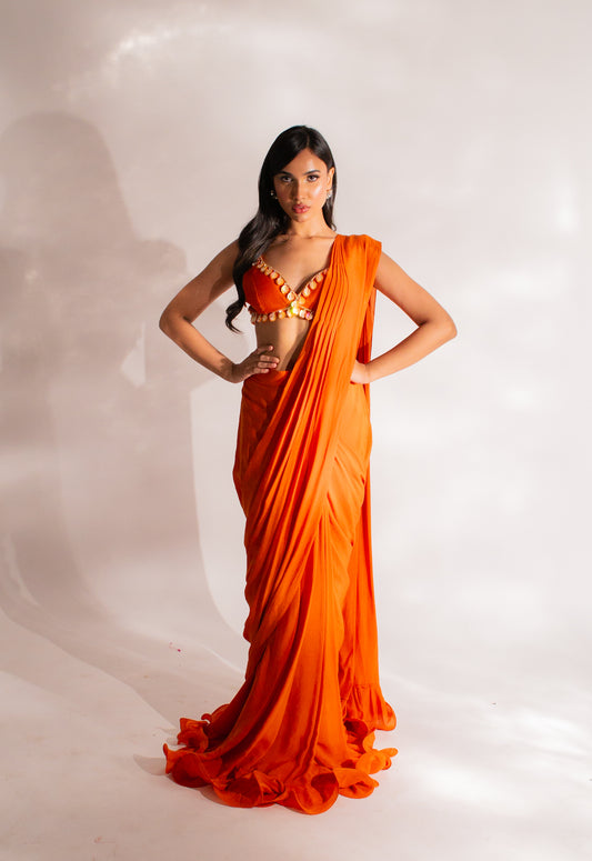 Radiant Allure in Orange: Embroidered Ruffle Saree with Abla Necklace and Embellished Pleated Pallu