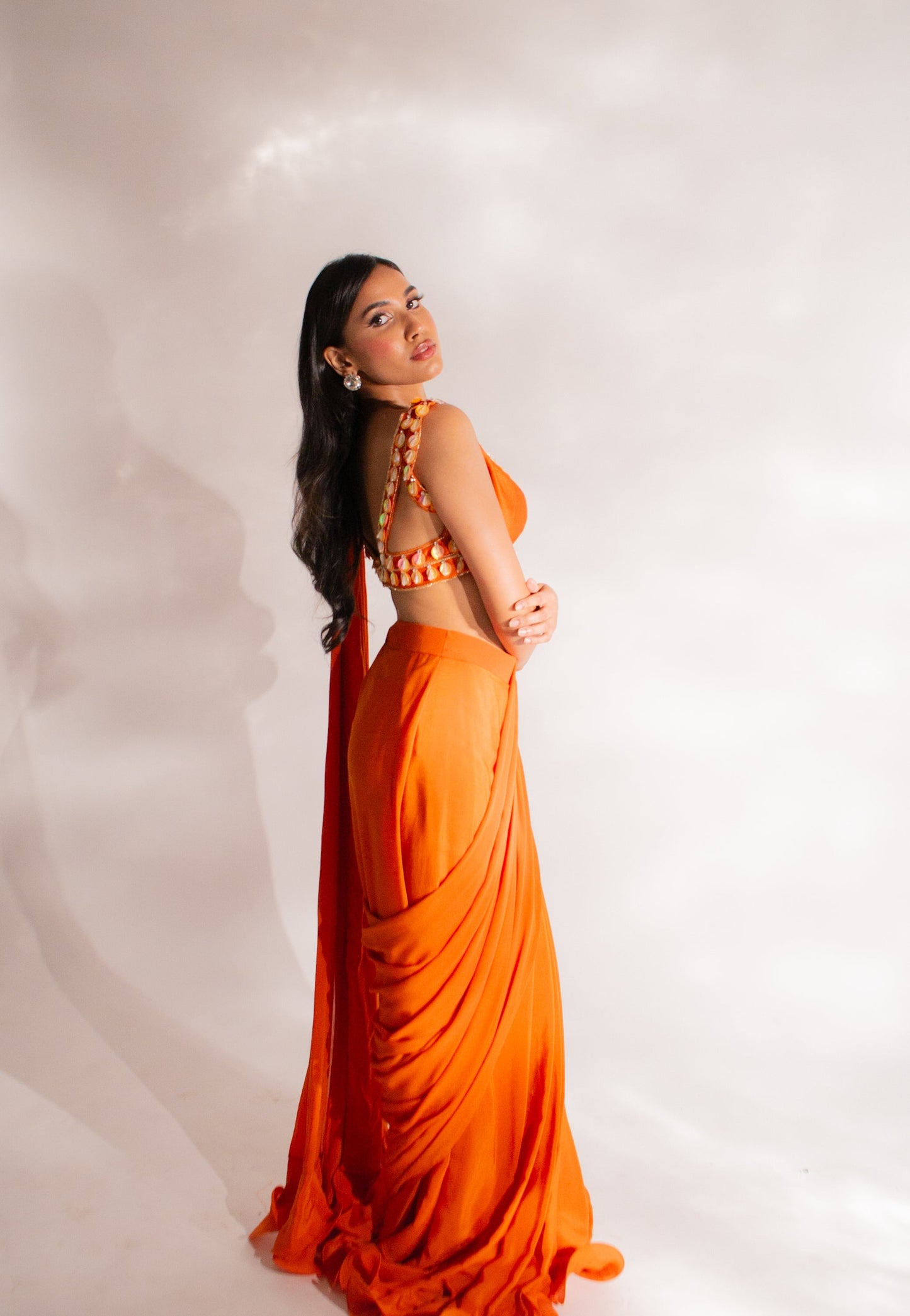 Palak Tiwari X Anshika Tak Label (Radiant Allure in Orange: Embroidered Ruffle Saree with Abla Necklace and Embellished Pleated Pallu)