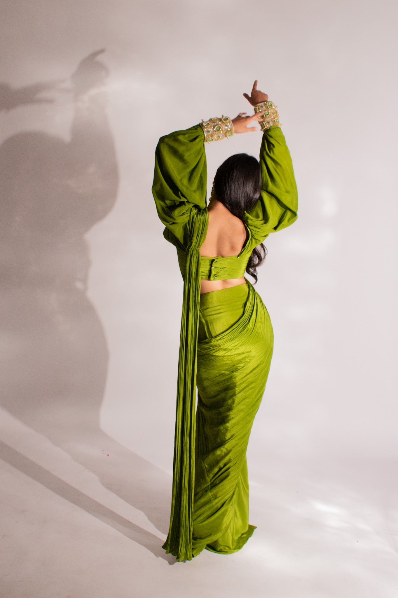 Parul Gulati X Anshika Tak Label (Ruched Allure: Modern Olive Green Draped Saree with Puff and Cuff Sleeves )