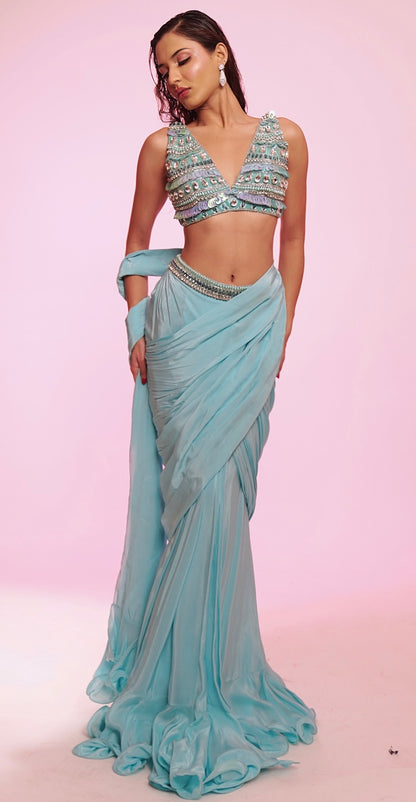 Aqua blue draped saree with embellished V-neck blouse