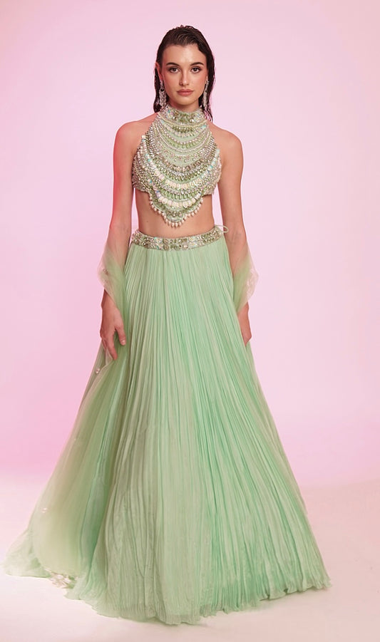 Mint green embellished halter-neck lehenga set with a statement jeweled bodice.