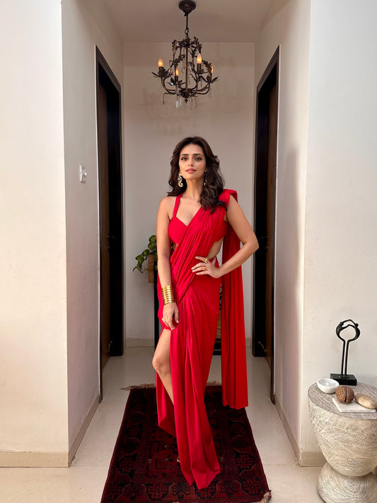 Roshni chopra X Anshika tak (Captivating Crimson Draped Saree with Alluring Blouse: A Dance of Elegance and Seduction)