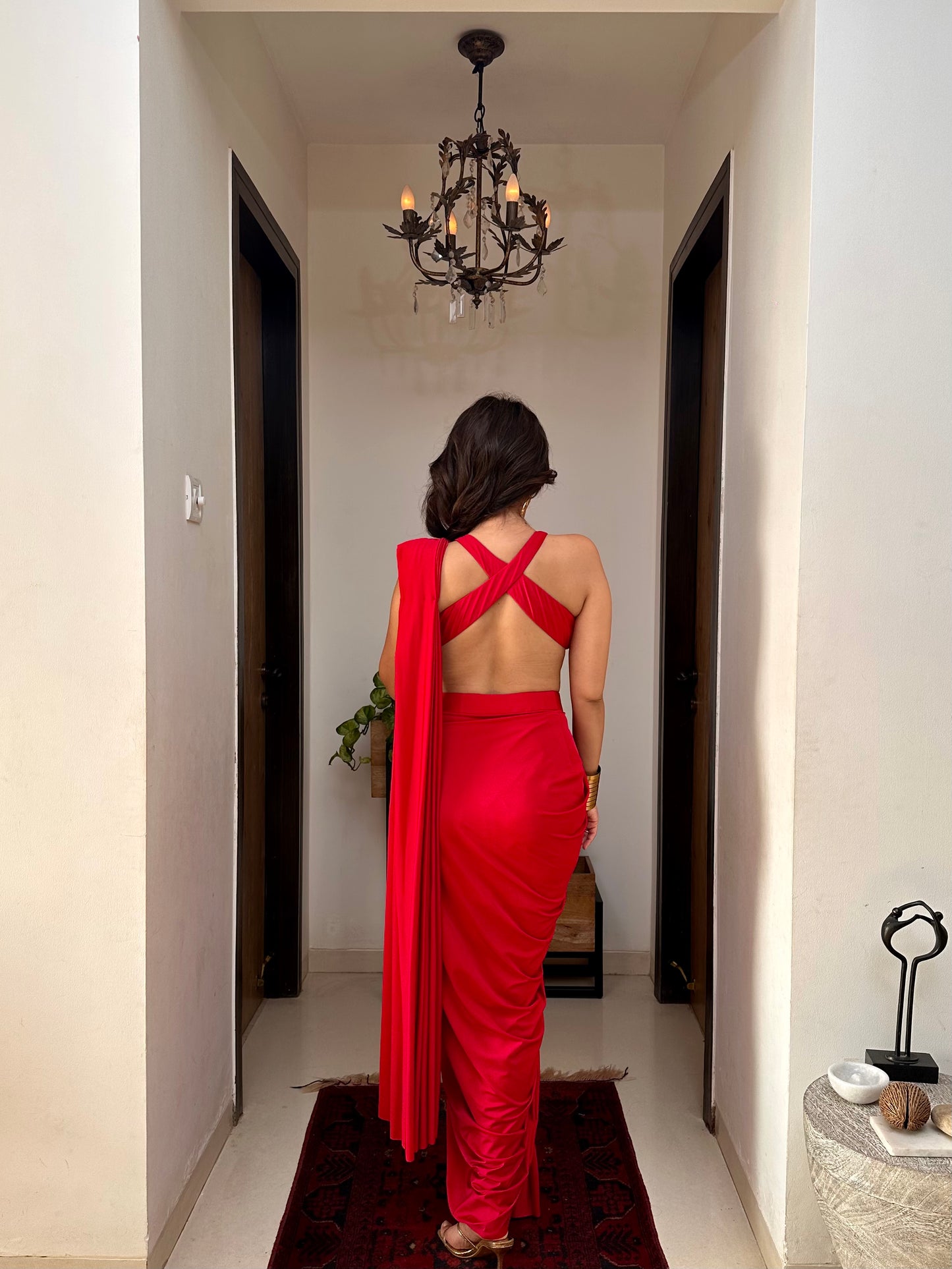 Roshni chopra X Anshika tak (Captivating Crimson Draped Saree with Alluring Blouse: A Dance of Elegance and Seduction)