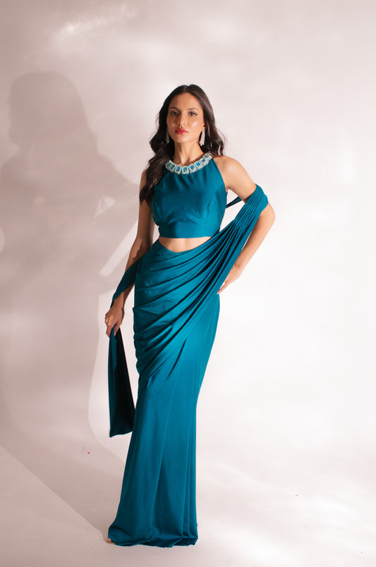 Teal Reverie: A Contemporary Classic &- Embellished Pleated Saree Elegance