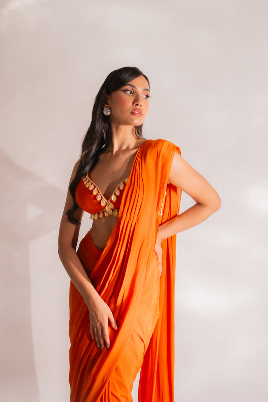 Radiant Allure in Orange: Embroidered Ruffle Saree with Abla Necklace and Embellished Pleated Pallu