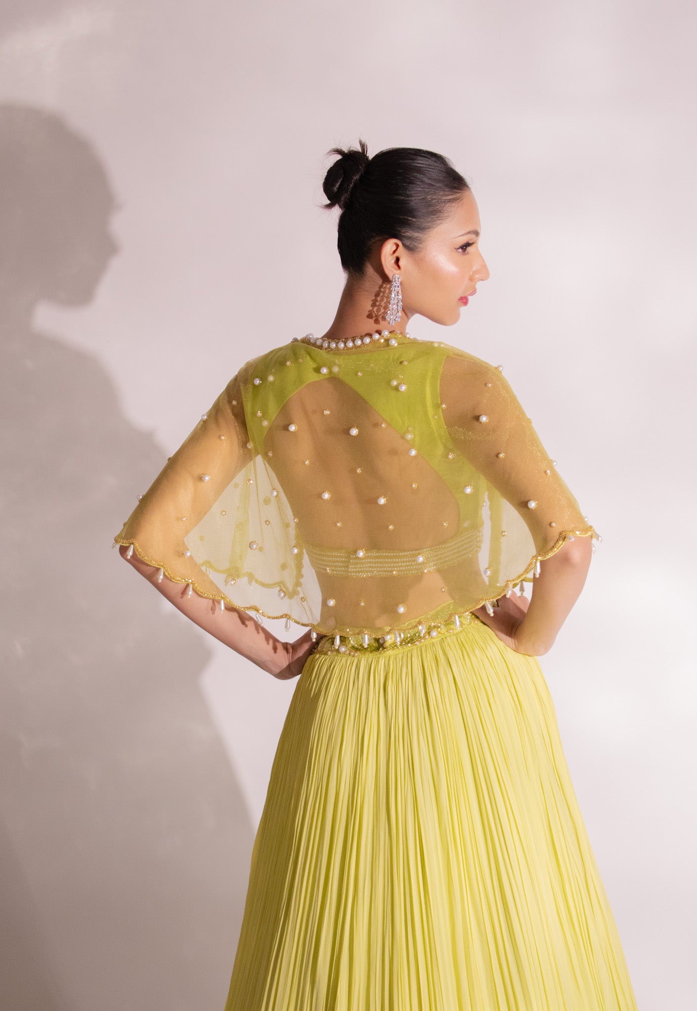 Green Heavy Lehenga With A Crop Top In Long Cape Embroidered Sleeves –  Akashi designer studio
