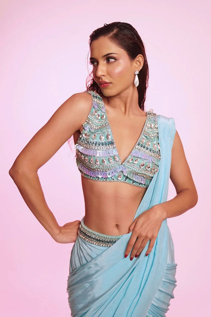 Aqua blue draped saree with embellished V-neck blouse